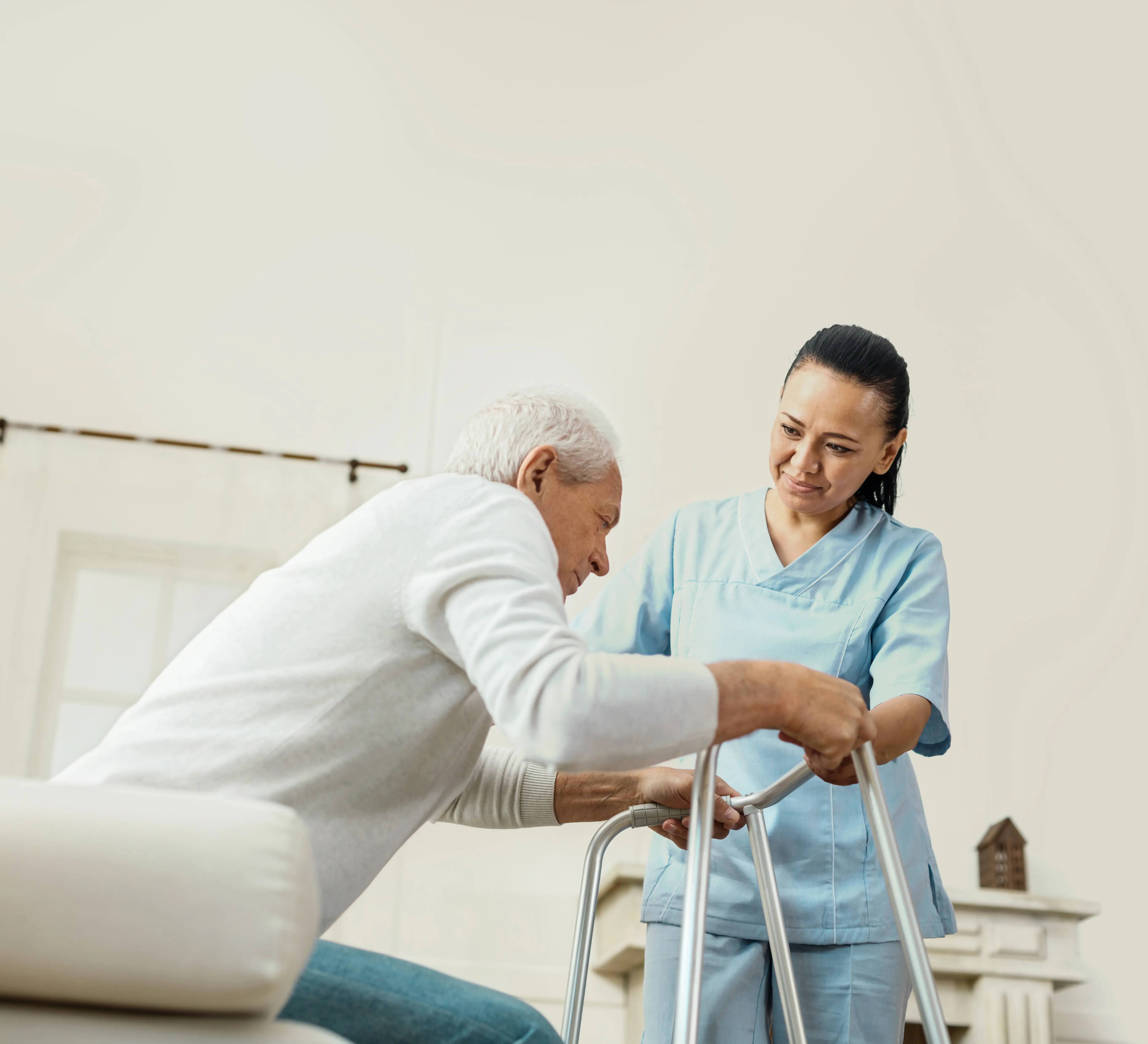 A caregiver supporting an elderly person at home
