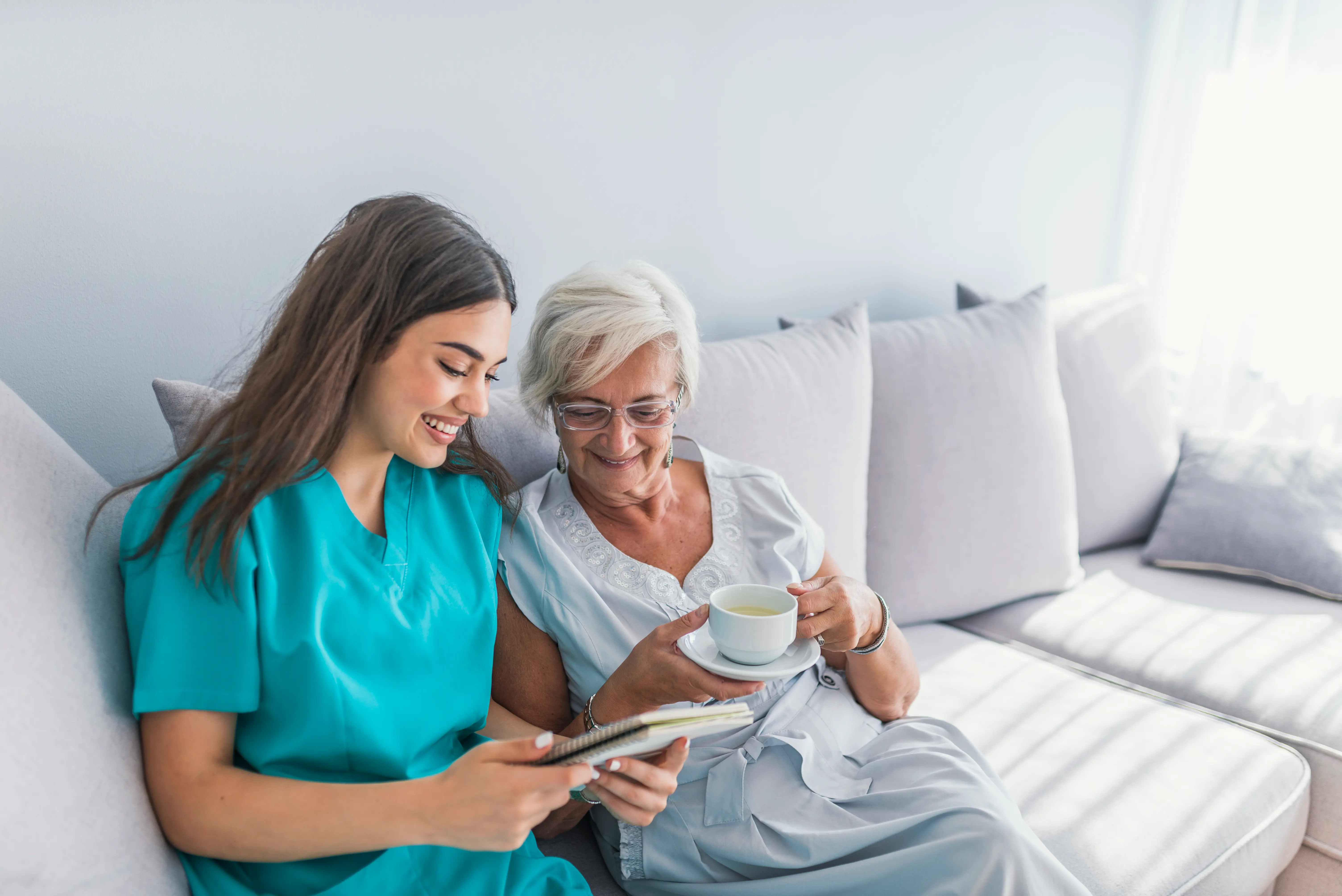 A nurse assisting an elderly person at home